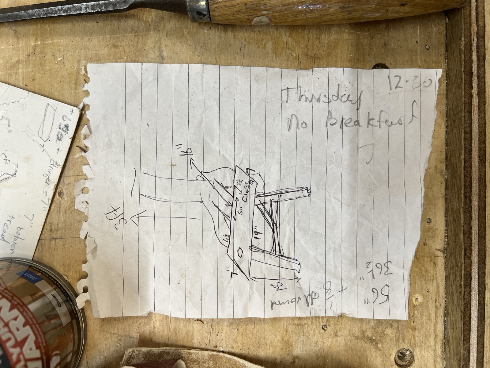 Richard's pencil design for a Sligo chair on a torn sheet of lined paper, on the workbench